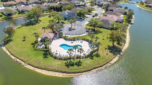 birds eye view of property with a water view and a residential view