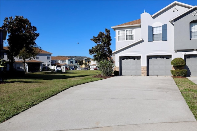 exterior space with a residential view, concrete driveway, a lawn, stucco siding, and a garage