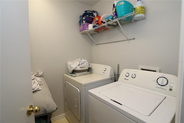 washroom with laundry area and washing machine and clothes dryer