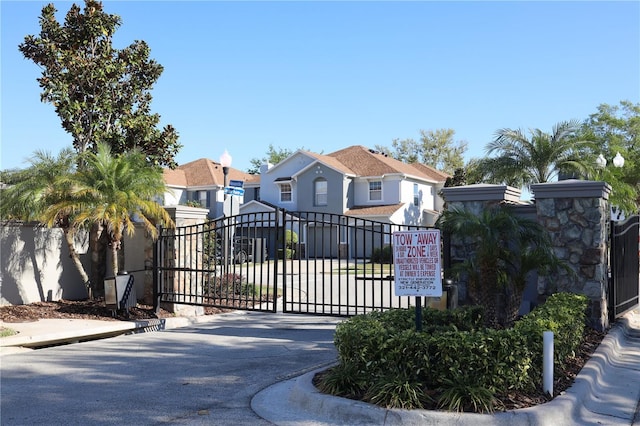 view of gate with fence