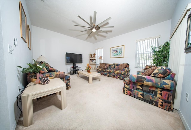 living room with carpet and ceiling fan