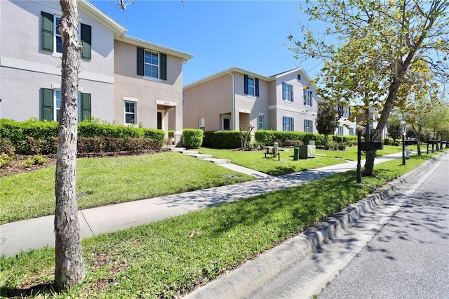 view of property's community with a yard