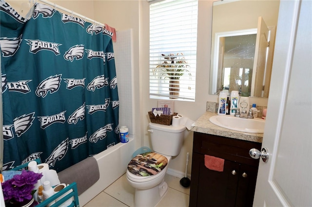 bathroom with tile patterned flooring, toilet, vanity, and shower / bath combo with shower curtain