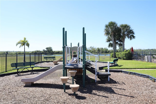 community play area with a yard and fence