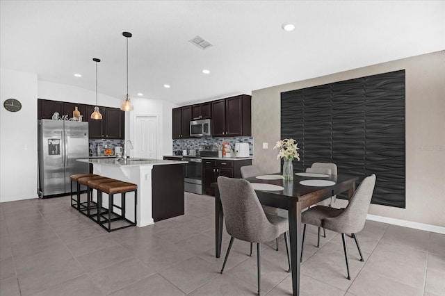 dining space featuring recessed lighting, light tile patterned flooring, and visible vents