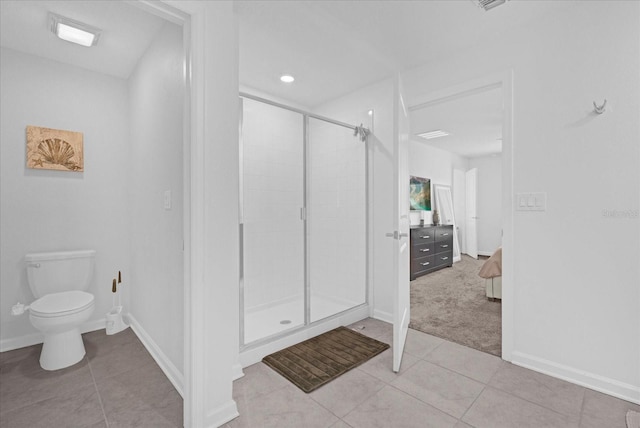 full bathroom with baseboards, tile patterned flooring, a shower stall, and toilet