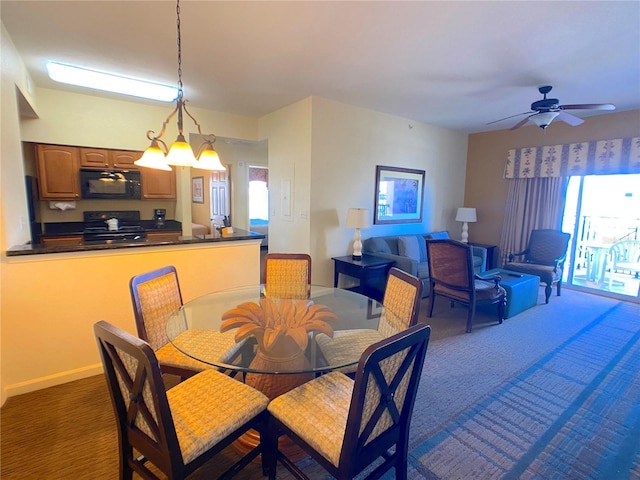 dining space with baseboards, carpet, and a healthy amount of sunlight