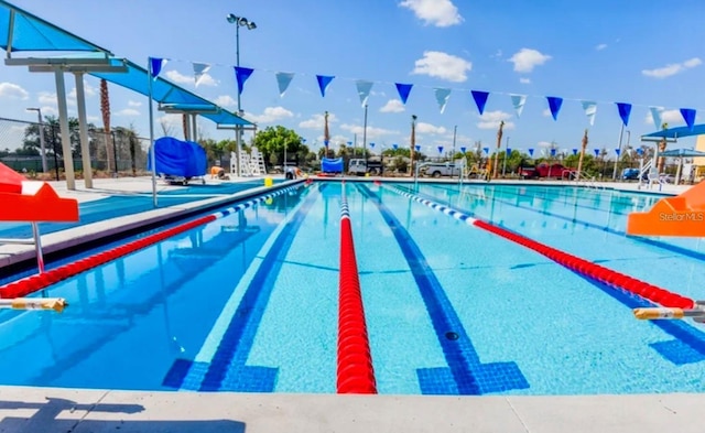 view of pool with fence