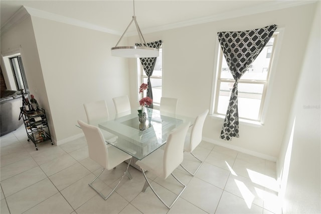 dining area featuring light tile patterned floors, baseboards, and crown molding