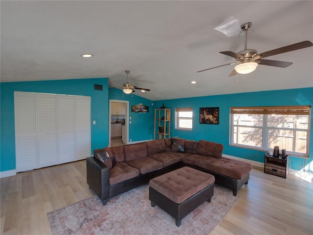 living room featuring baseboards, a ceiling fan, lofted ceiling, wood finished floors, and recessed lighting