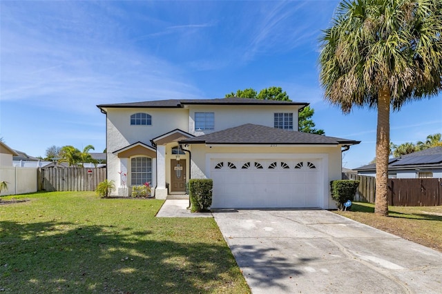 traditional-style house with a garage, fence, driveway, stucco siding, and a front yard