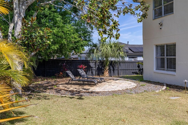 view of yard with fence and a patio