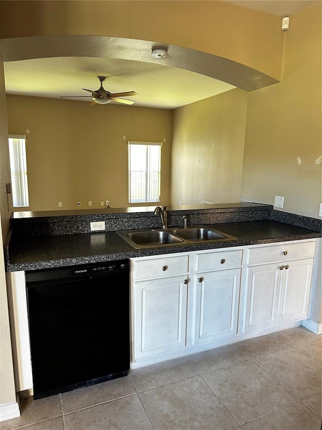 kitchen with black dishwasher, ceiling fan, a sink, and white cabinetry