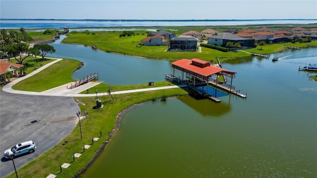 aerial view featuring a water view and a residential view