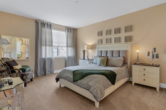 carpeted bedroom with baseboards