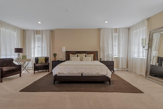 carpeted bedroom with recessed lighting