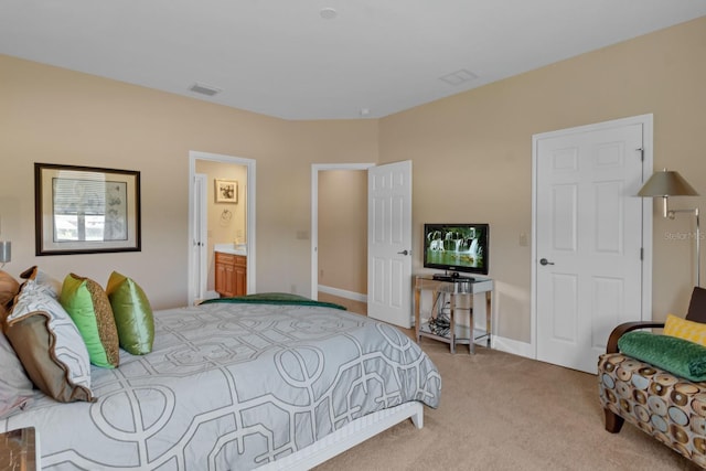 bedroom with light carpet and baseboards