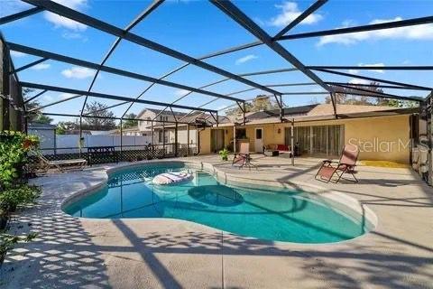 view of pool featuring a patio, a lanai, and a fenced in pool