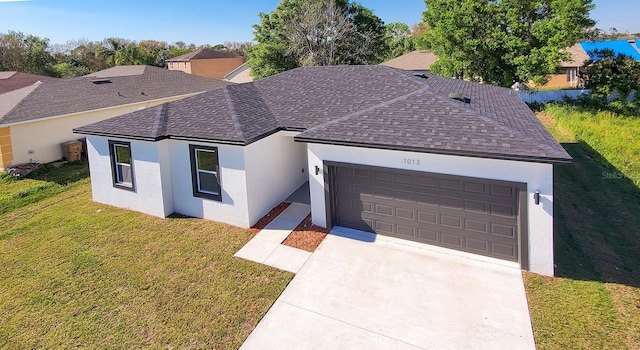 single story home with a front lawn, roof with shingles, an attached garage, and stucco siding