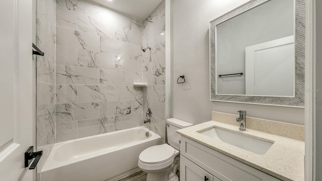 bathroom featuring toilet, vanity, and shower / bathing tub combination