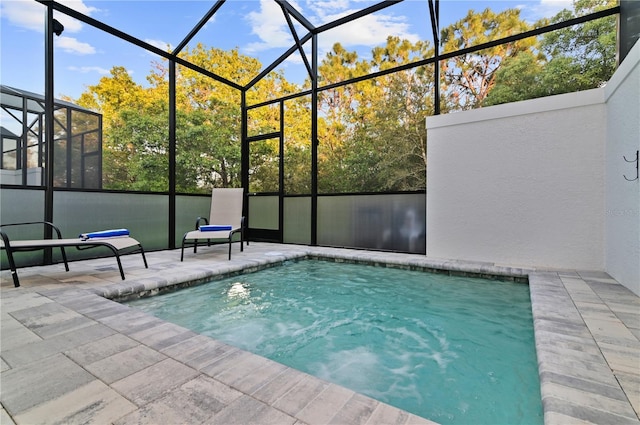 view of pool featuring a lanai and a patio