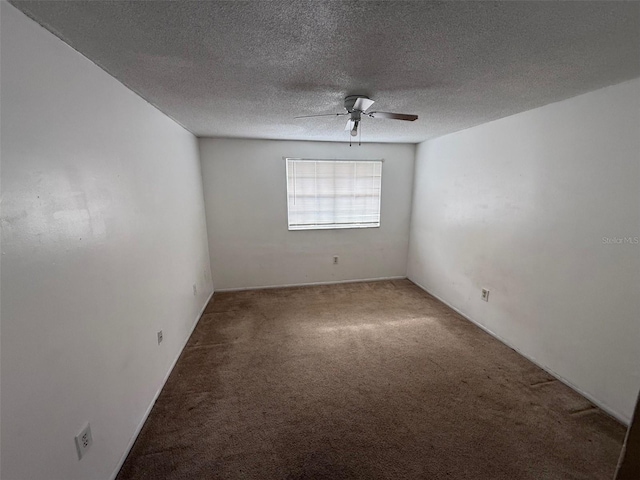 unfurnished room featuring a textured ceiling, carpet, and a ceiling fan