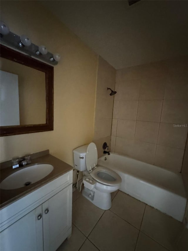 full bathroom featuring tile patterned flooring, bathtub / shower combination, vanity, and toilet