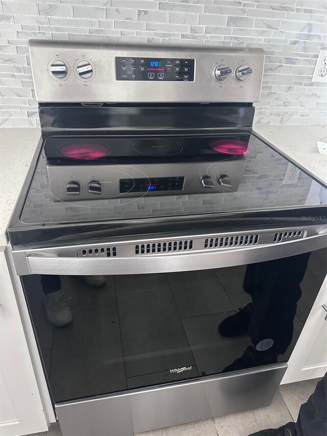 room details with stainless steel range with electric cooktop