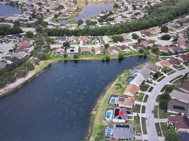 birds eye view of property featuring a residential view and a water view