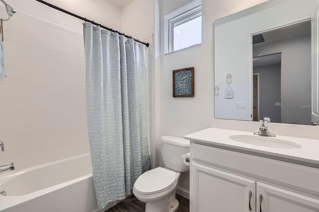 full bathroom featuring visible vents, shower / bathtub combination with curtain, toilet, vanity, and wood finished floors