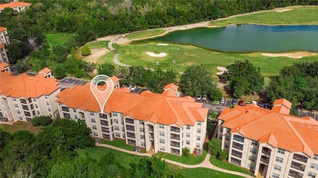 birds eye view of property featuring a water view and golf course view