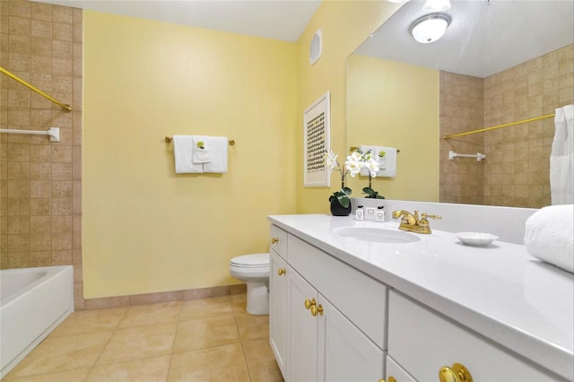 bathroom featuring toilet, vanity,  shower combination, tile patterned flooring, and baseboards