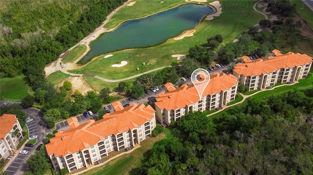 bird's eye view featuring view of golf course and a water view