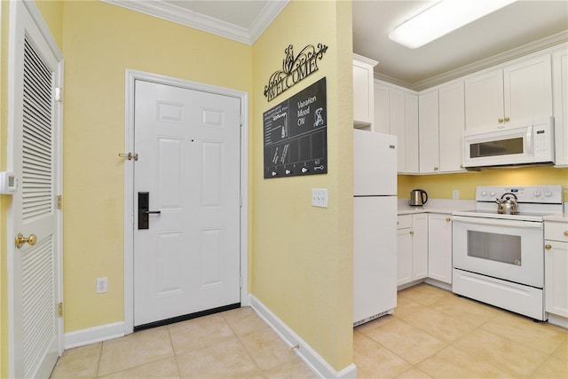 kitchen with white appliances, light tile patterned floors, white cabinets, ornamental molding, and light countertops