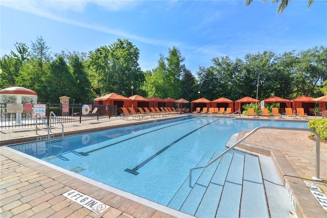 pool featuring a patio area, fence, and a gazebo