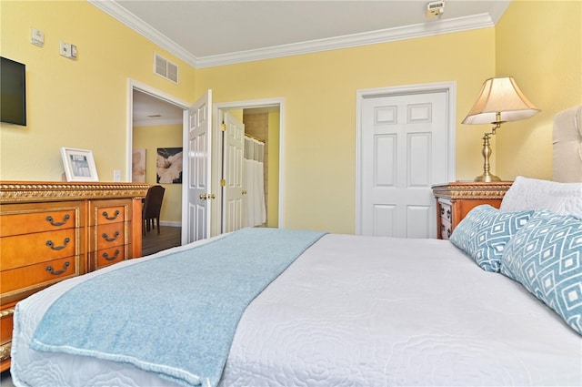 bedroom with ornamental molding and visible vents