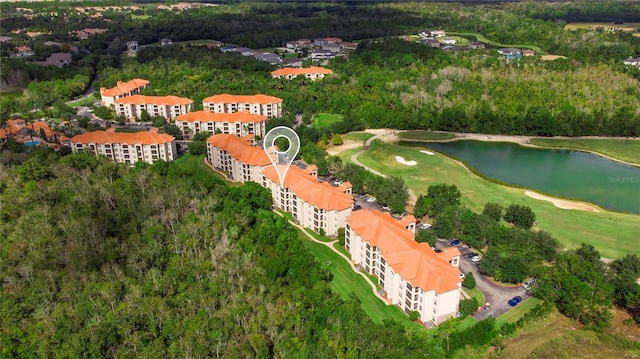 bird's eye view featuring a water view and view of golf course