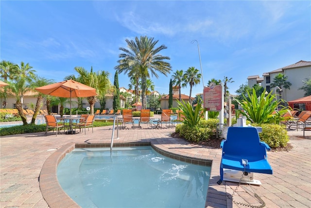 community pool featuring a patio