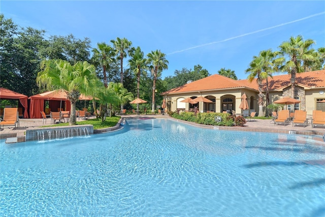 pool with a patio and a gazebo