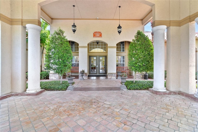 doorway to property with french doors and stucco siding