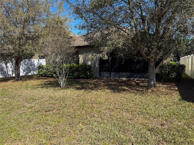 view of yard featuring fence