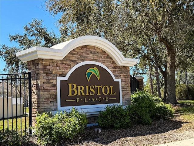 community sign featuring fence