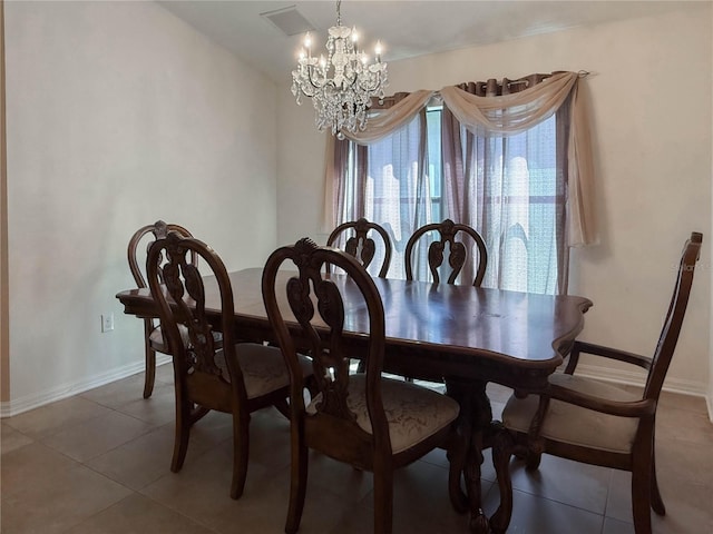 dining room with visible vents, baseboards, a notable chandelier, and tile patterned floors