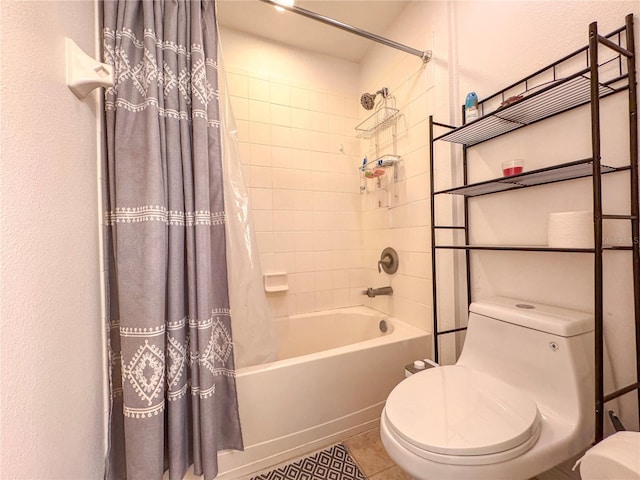 bathroom with toilet, tile patterned flooring, and shower / bath combo