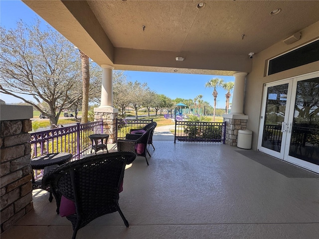 view of patio with french doors and a porch