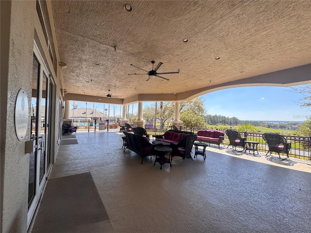 view of patio / terrace with a ceiling fan and an outdoor hangout area