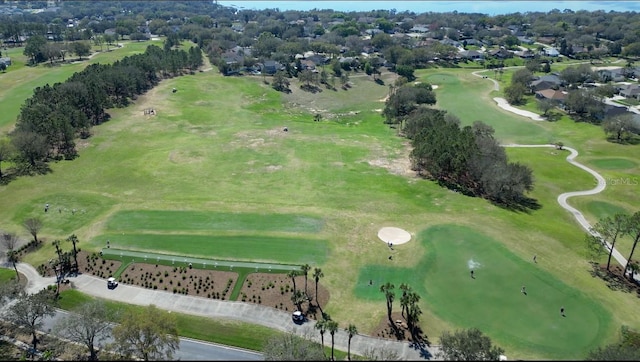 birds eye view of property with view of golf course