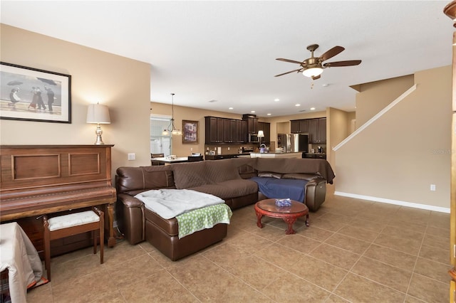 living room featuring light tile patterned floors, baseboards, a ceiling fan, and recessed lighting