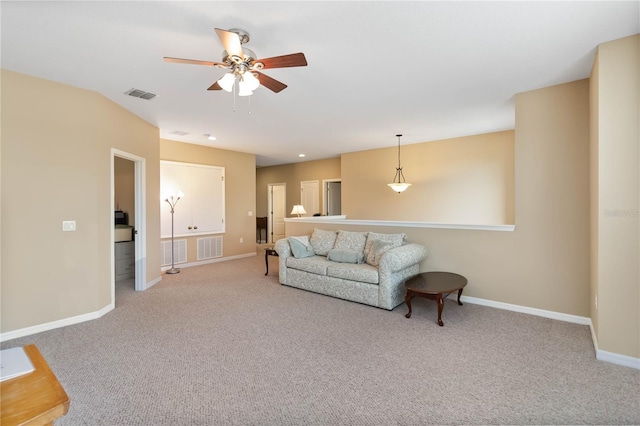 carpeted living room with a ceiling fan, recessed lighting, visible vents, and baseboards