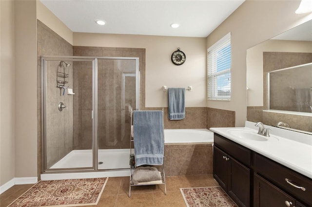 bathroom with tile patterned flooring, a shower stall, vanity, and a bath